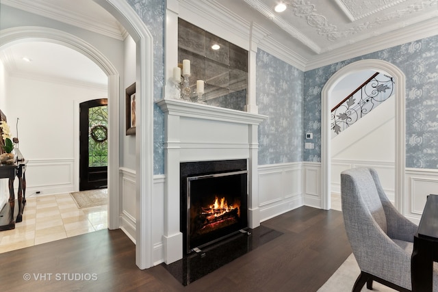 interior space with wood-type flooring and ornamental molding