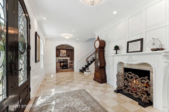 foyer entrance with french doors and crown molding