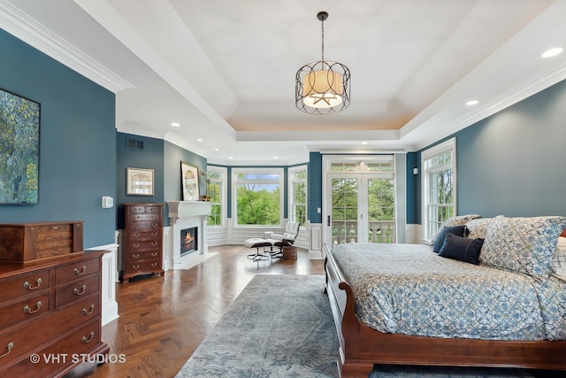 bedroom featuring multiple windows, dark parquet floors, ornamental molding, and access to outside