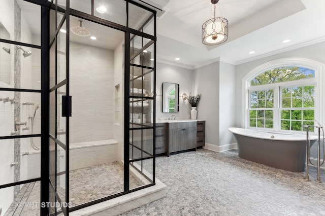 bathroom with crown molding, separate shower and tub, and vanity