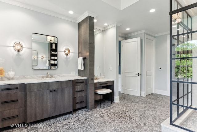 bathroom featuring vanity and ornamental molding