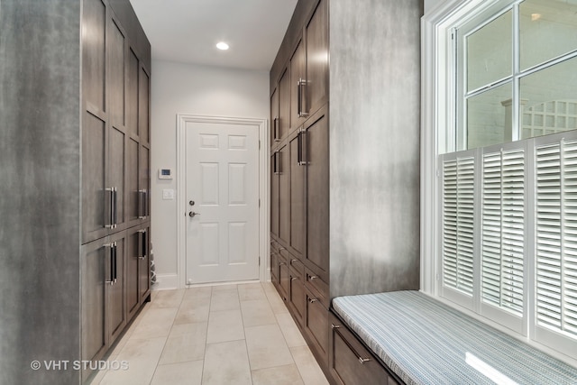 mudroom with light tile patterned flooring