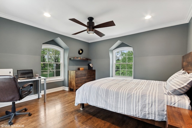 bedroom with ornamental molding, lofted ceiling, ceiling fan, and hardwood / wood-style floors