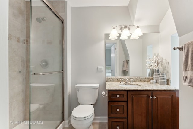 bathroom featuring walk in shower, vanity, and toilet