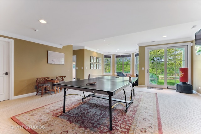 playroom featuring ornamental molding and light carpet