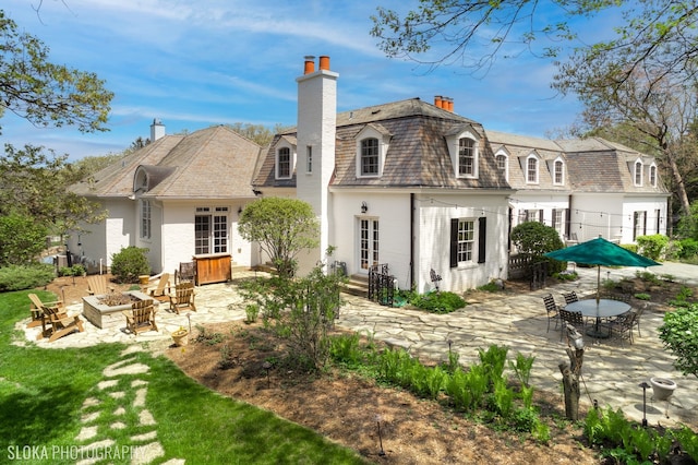 back of house featuring french doors and a patio