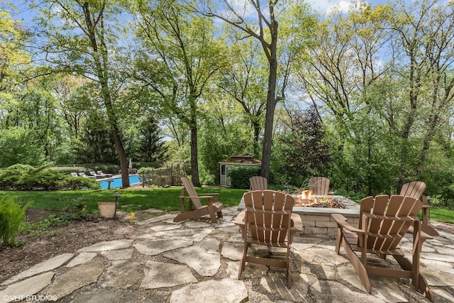 view of patio / terrace featuring an outdoor fire pit