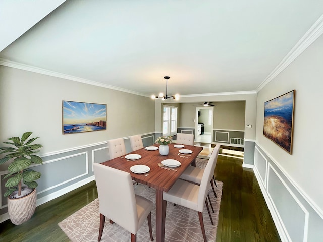 dining area featuring a notable chandelier, dark hardwood / wood-style floors, and ornamental molding