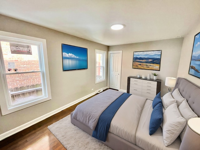 bedroom with hardwood / wood-style flooring