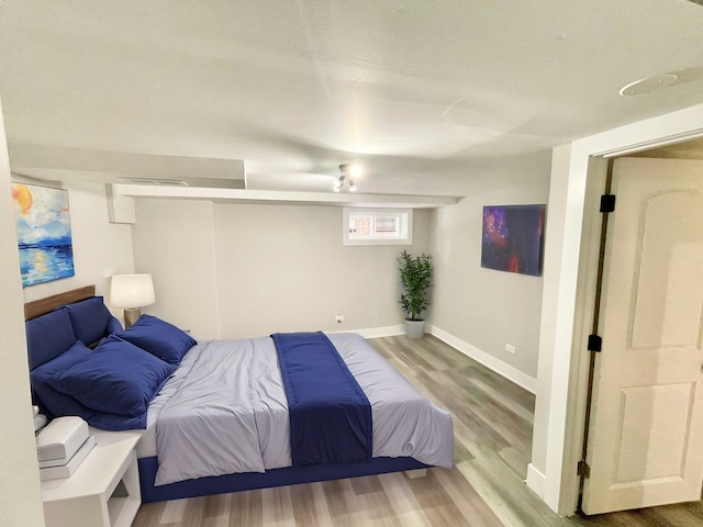 bedroom with hardwood / wood-style flooring and ceiling fan