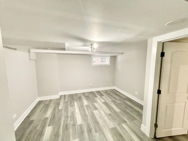 basement featuring light wood-type flooring