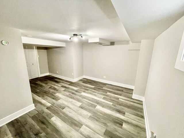 basement featuring dark wood-type flooring