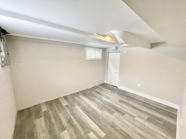 basement featuring light wood-type flooring