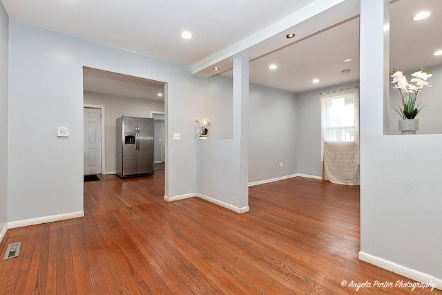 empty room featuring wood-type flooring