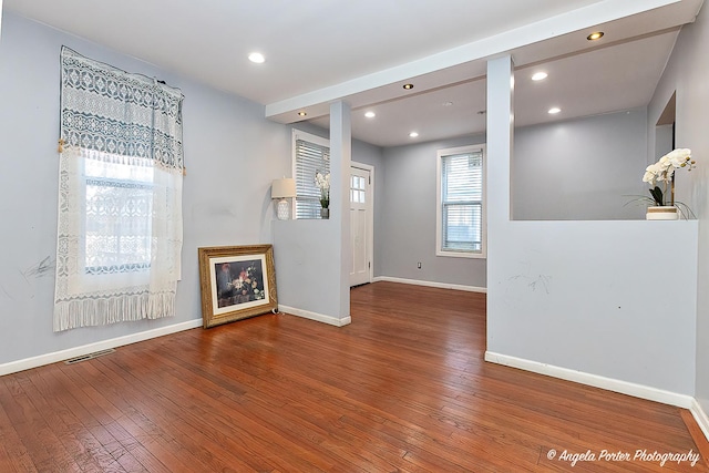 unfurnished living room featuring hardwood / wood-style floors