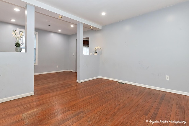 unfurnished room with hardwood / wood-style floors