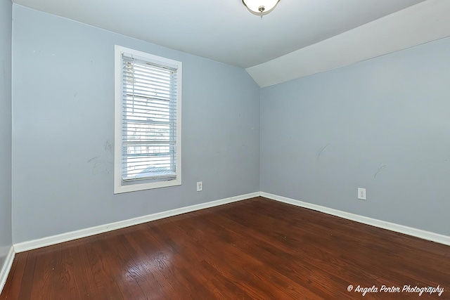 bonus room with hardwood / wood-style flooring and lofted ceiling