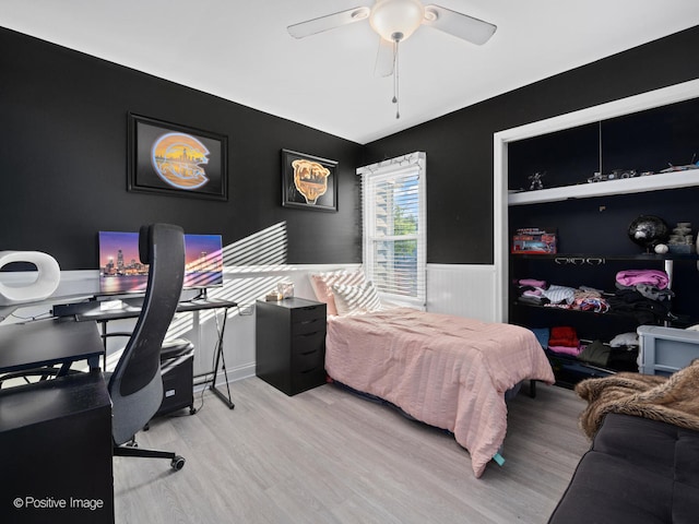 bedroom featuring light hardwood / wood-style flooring and ceiling fan