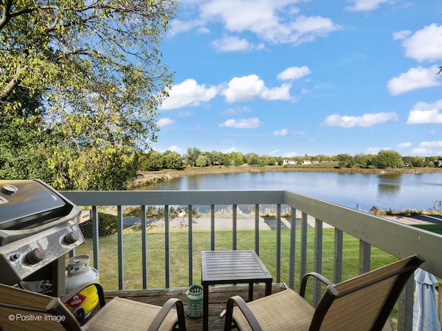 balcony with a grill and a water view