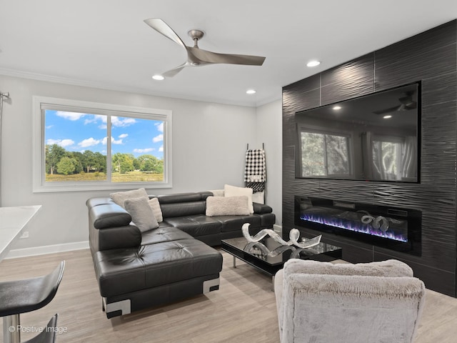 living room featuring light hardwood / wood-style floors and ceiling fan