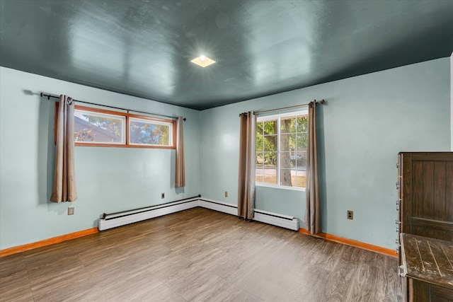 empty room featuring a baseboard radiator