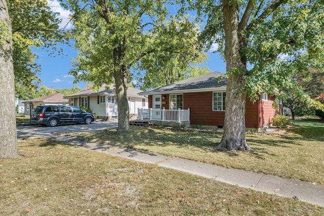 ranch-style home with a front yard