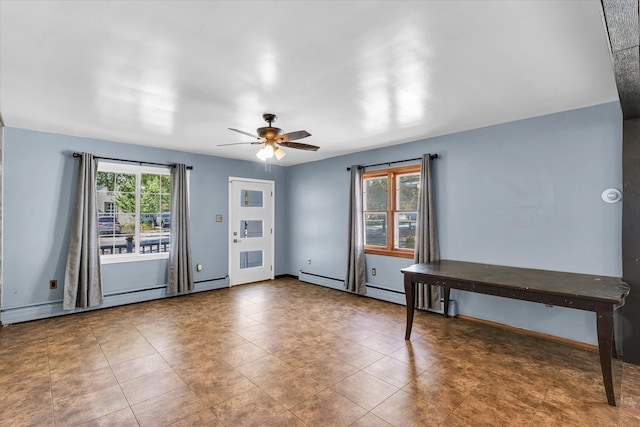 unfurnished room with ceiling fan and a baseboard radiator