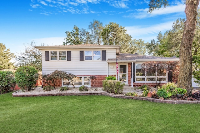 split level home with a front yard