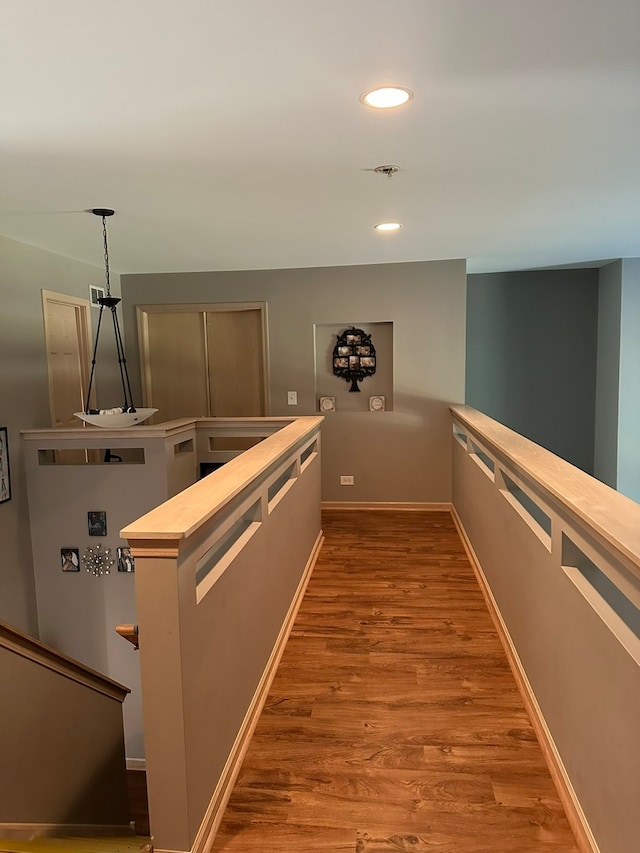 kitchen with decorative backsplash, gray cabinets, a kitchen island, pendant lighting, and stainless steel fridge