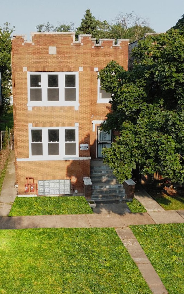 6830 S Michigan Ave, Chicago, IL 60637 - view of front facade featuring brick siding and a front yard