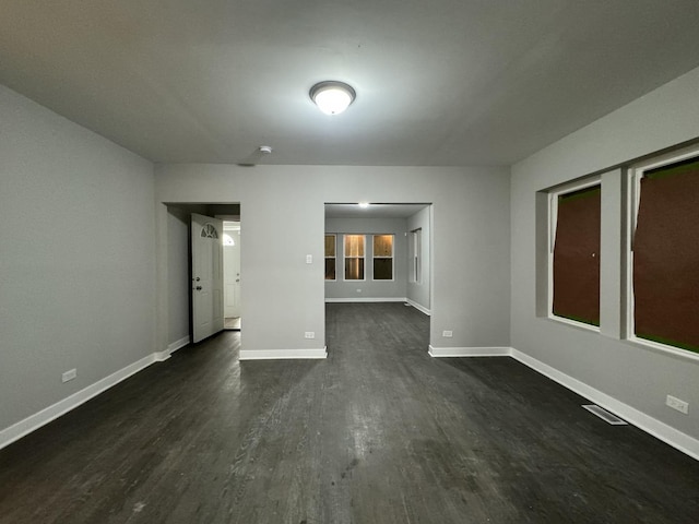 6830 S Michigan Ave, Chicago, IL 60637 - unfurnished room with dark wood-style floors and baseboards