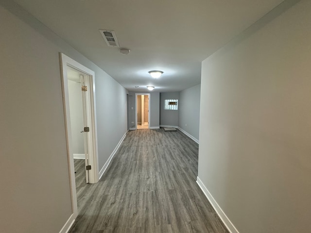 corridor featuring wood-type flooring