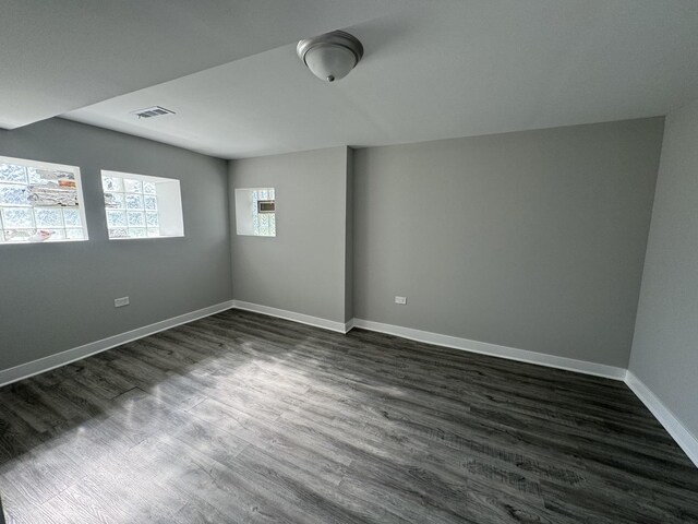 6830 S Michigan Ave, Chicago, IL 60637 - empty room with baseboards and dark wood finished floors