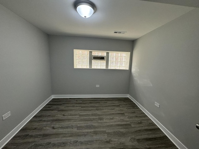 6830 S Michigan Ave, Chicago, IL 60637 - spare room featuring baseboards and dark wood finished floors