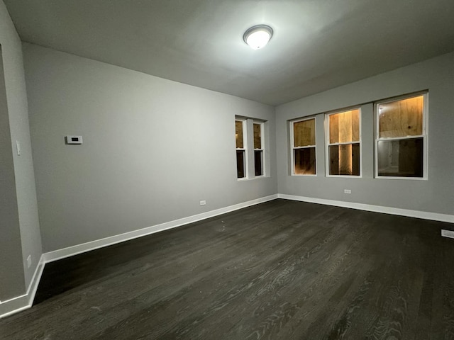 6830 S Michigan Ave, Chicago, IL 60637 - unfurnished room with dark wood-type flooring and baseboards