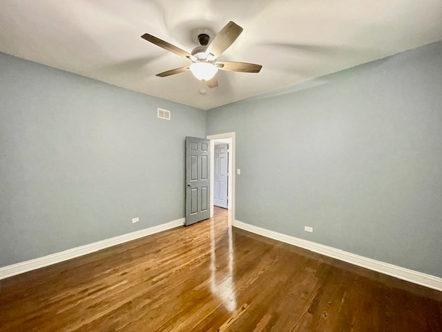 unfurnished bedroom with ceiling fan and hardwood / wood-style floors