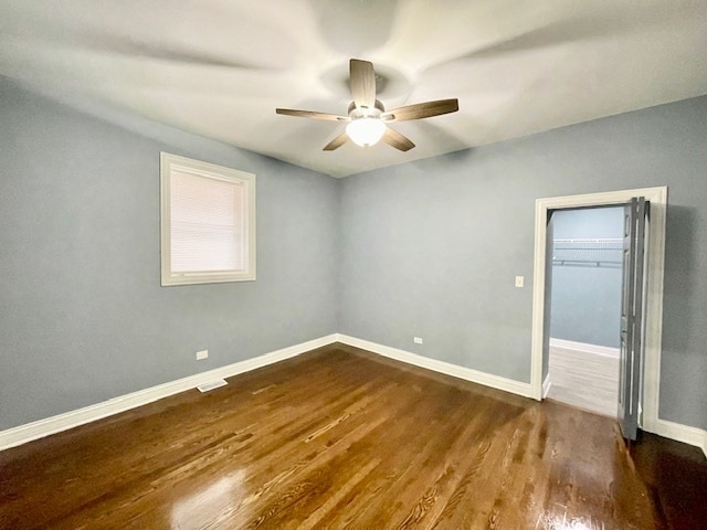 unfurnished room featuring wood-type flooring and ceiling fan