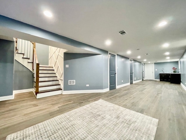 basement featuring hardwood / wood-style flooring