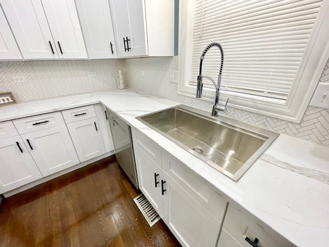 kitchen with dark hardwood / wood-style floors, sink, and white cabinets