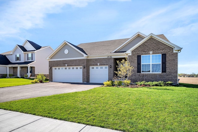 view of front of home with a garage and a front lawn