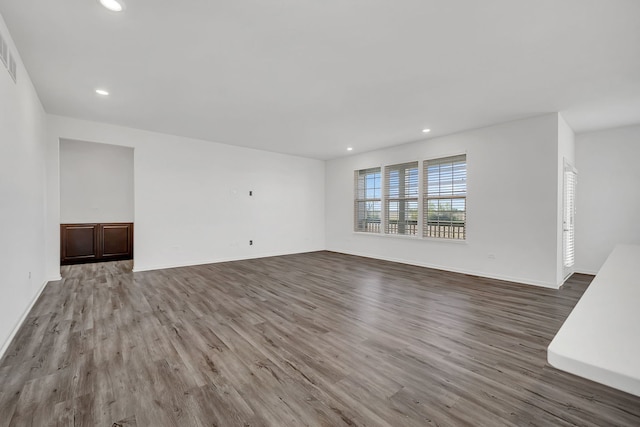 unfurnished living room with hardwood / wood-style floors