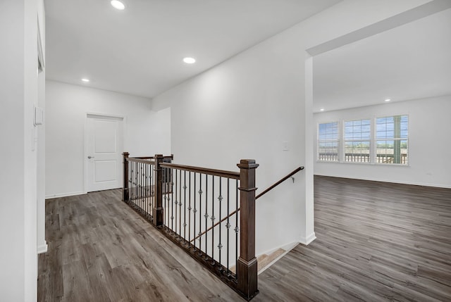 hall with wood-type flooring