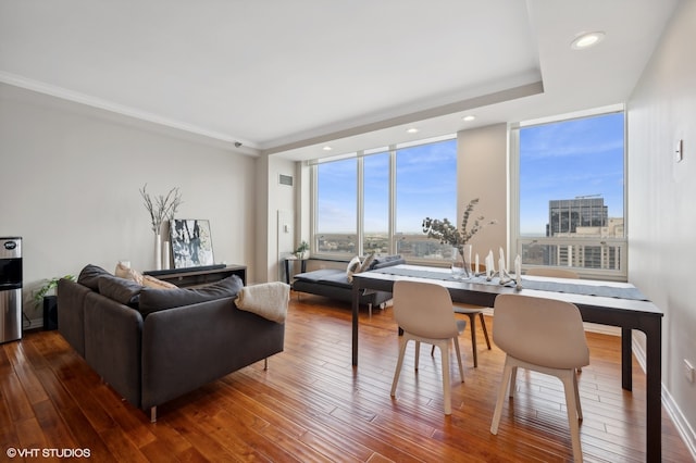 living room featuring wood-type flooring and expansive windows