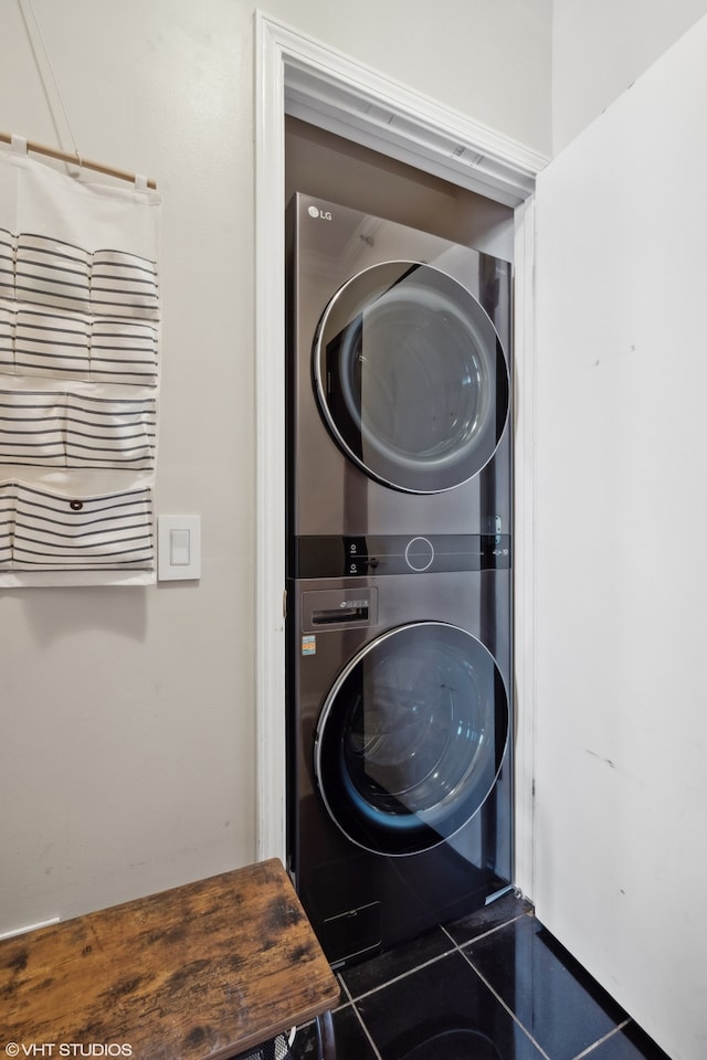 laundry area with stacked washer / dryer