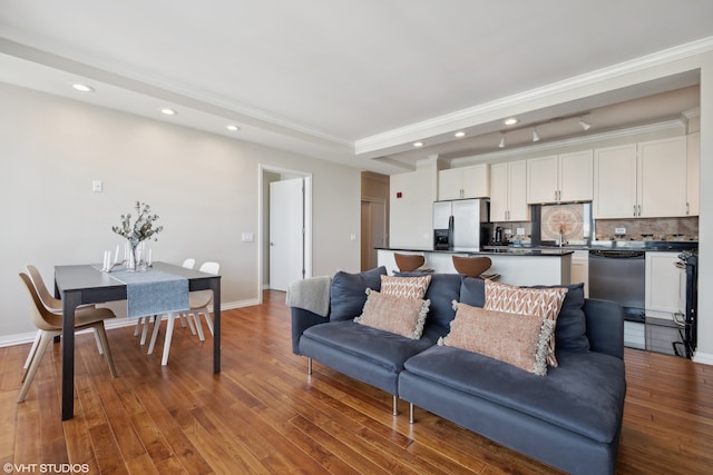 living room with ornamental molding and hardwood / wood-style floors