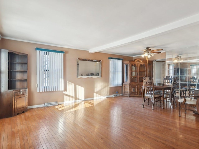 unfurnished dining area featuring beam ceiling, ceiling fan, wood-type flooring, and ornamental molding