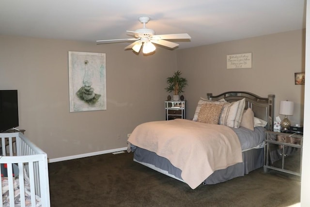 bedroom with ceiling fan and dark carpet