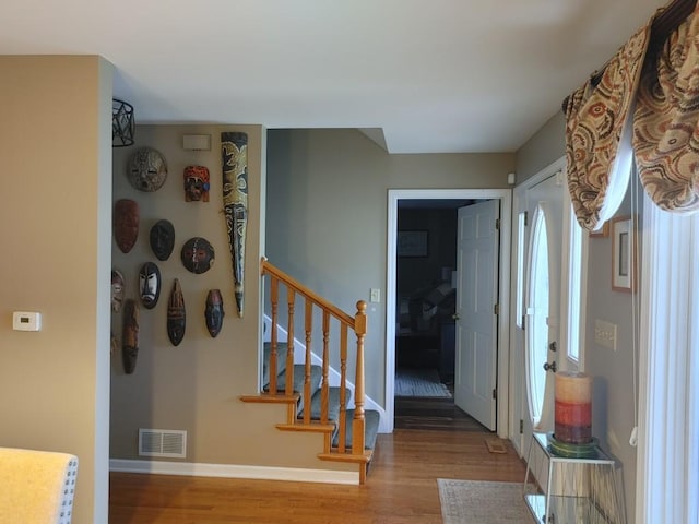 foyer entrance with light hardwood / wood-style flooring