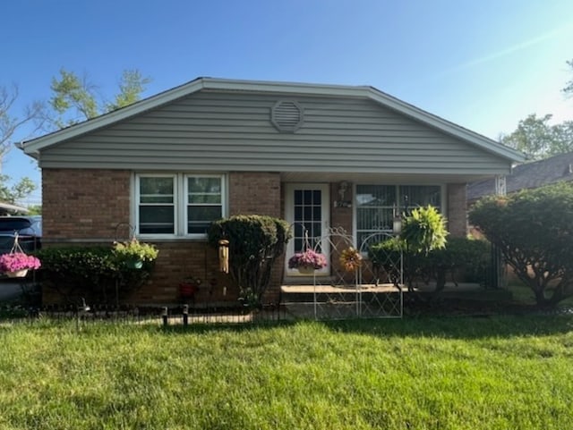 bungalow with a front lawn