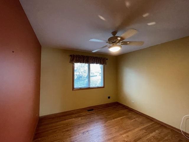 unfurnished room featuring wood-type flooring and ceiling fan